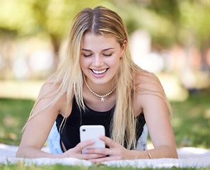 Image showing Happy, relax or girl with phone in park with smile for online meme, reading comic blog or social media. Search, typing or woman with 5g smartphone for networking communication or funny news outdoors