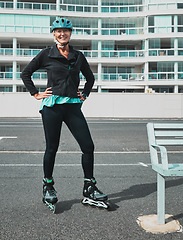 Image showing Roller skate, smile and senior woman in city ready for sports, adventure and fitness hobby outdoors. Retirement, holiday and portrait of elderly female excited for skating, travel activity and relax