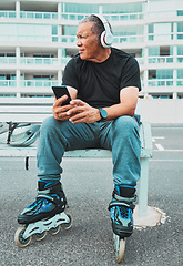 Image showing Roller skate, music and senior man with phone in city for sports, exercise and fitness hobby outdoor. Retirement, travel and cool male listen to audio, radio and track for skating, activity and relax