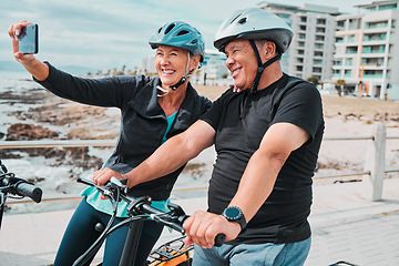 Image showing Cycling, smile and fitness with old couple and selfie for social media, workout and health training. Wellness, internet and blog with senior man and woman on bike for sports, exercise and travel