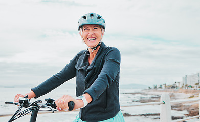 Image showing Laughing woman, helmet or electrical bike by sea in transport, clean energy fitness or sustainability travel. Ebike, electricity or eco friendly bicycle for happy, comic or mature person in cycling