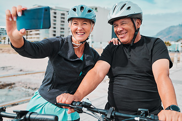 Image showing Cycling, smile and phone with old couple and selfie for social media, workout and health training. Wellness, internet and blog with senior man and woman on bike for summer, exercise and travel