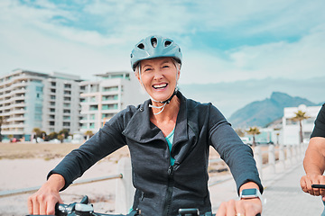 Image showing Mature woman, bike or helmet portrait for beach promenade cycling in wellness exercise, fitness or cardiology healthcare. Smile, happy or elderly person in bicycle head safety or eco friendly workout