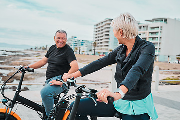Image showing Mature people, electrical or bike by ocean, beach or sea in bonding transportation, clean energy or sustainability travel. Ebike, electricity or eco friendly bicycle for happy couple or cycling woman