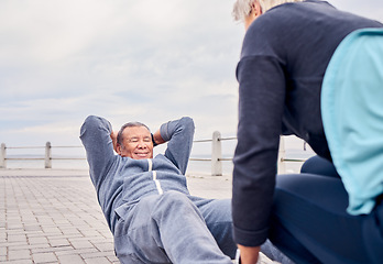 Image showing Fitness, exercise and sit ups with a senior couple training outdoor together for an active lifestyle of wellness. Workout, health or core with a mature man and woman outside on the promenade