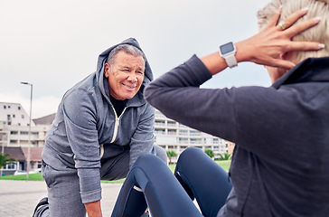 Image showing Fitness, workout and sit ups with a senior couple training outdoor together for an active lifestyle of wellness. Health, exercise or core with a mature man and woman outside on the promenade