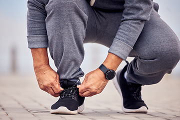 Image showing Lace shoes, man and ground for workout, training and power for cardio marathon outdoors. Closeup guy tie sneakers for exercise, sports and running for healthy body, fitness goals and runner footwear