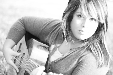 Image showing Girl Playing a Guitar