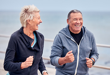 Image showing Running, fitness and senior couple smile by ocean for exercise, healthy body and wellness in retirement. Sports, endurance and happy elderly man and woman run, cardio workout and marathon training