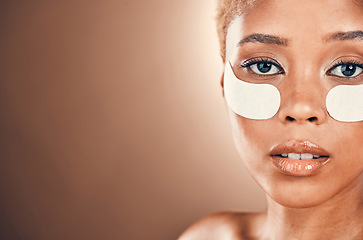 Image showing Black woman, eyes and portrait for beauty patch on a mockup background for collagen dermatology. Aesthetic model person in studio for skincare, self care and facial skin glow with gel mask space