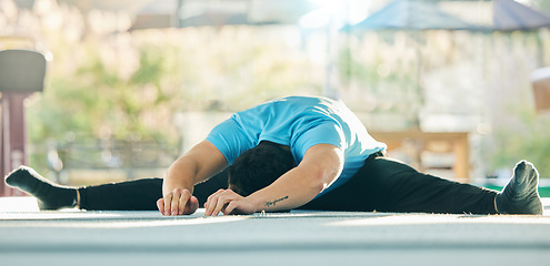 Image showing Gymnast stretching, man in gym with fitness and flexibility, professional athlete with gymnastics and training. Exercise studio, warm up and active lifestyle, workout with male in gymnasium and sport