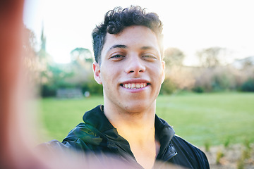 Image showing Man, selfie and smile at outdoor park in summer for walk, wellness and portrait by blurred background. Young gen z guy, headshot and nature in spring with profile picture for social media in sunshine