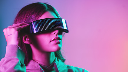 Image showing Virtual reality, cyberpunk and mockup, woman in goggles in online metaverse app, game or video on neon purple background. Vr, ar and ux, future fashion digital glasses on model in studio with space.