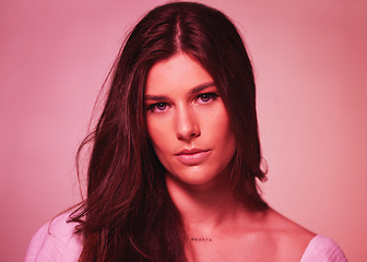 Image showing Portrait, neon and gen z with a model woman in studio on a pink background for beauty or skincare. Face, art and fantasy with an attractive young female posing on a color wall for a retro aesthetic