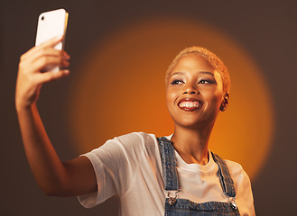 Image showing Beauty, selfie and black woman in studio for makeup, fun and spotlight aesthetic on gradient background. Social media, girl and fashion influencer smile for blog, profile picture or homepage update