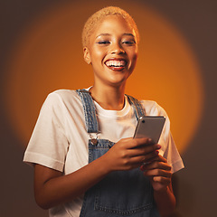 Image showing Portrait of black woman, smile and phone, typing message or email and browsing social media isolated in studio. Internet, connection and gen z fashion, happy influencer girl with smartphone in hands.