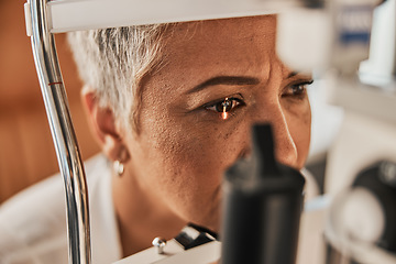 Image showing Laser, vision or senior customer in eye exam for eyesight at optometrist office in assessment or consultation. Face of mature woman testing or checking vision to help iris or retina visual health