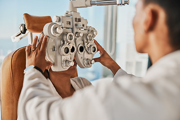 Image showing Senior optometry woman, eye exam patient and medical goal in hospital, consultation room and office with help. Elderly optician, eyesight test and phoropter for wellness, health and vision analysis