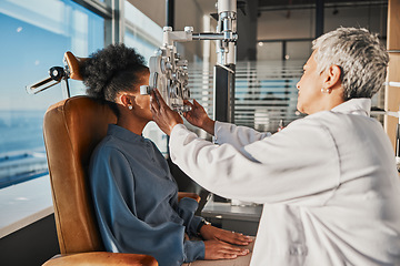 Image showing Vision test, eye exam and black woman with optometrist for testing, eyesight and optical assessment. Healthcare, optometry office and patient with medical equipment, phoropter and lens for eyes