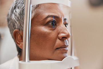 Image showing Laser, face or senior woman in eye exam for eyesight at optometrist or ophthalmologist office. Zoom of optician helping a mature customer testing or checking vision, iris or retina visual health