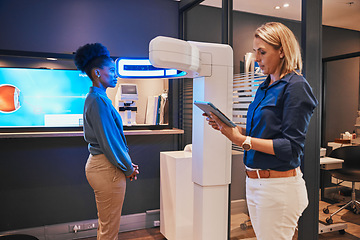 Image showing Eye exam, digital machine and optometrist with black woman for eyesight, vision test and optical consulting. Healthcare, ophthalmology and optician with patient and medical tech, monitor and tablet