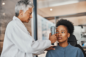 Image showing Help, eye test or black woman consulting doctor for eyesight at optometrist or ophthalmologist. African customer testing vision with senior optician helping or checking iris or retina visual health