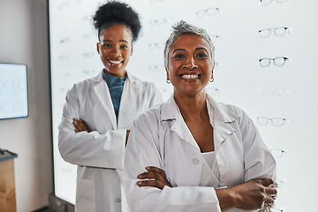 Image showing Portrait, optometrist teamwork and smile of women in shop or store for glasses, eyewear or eye care spectacles. Ophthalmology, vision and happy, proud or confident senior optician with black woman.