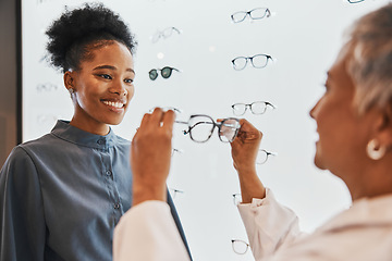 Image showing Vision, optician and black woman shopping for glasses in optometry store or shop for ophthalmology. Doctor, healthcare and happy female or medical ophthalmologist with eyewear or lenses for eye care.
