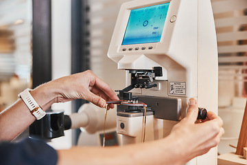 Image showing Lens machine, glasses and hands of optometrist for eyeglasses, prescription and vision frames in clinic. Healthcare, ophthalmology and optician working on eyesight, eye care and medical eyewear