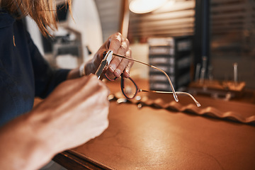 Image showing Hands, glasses and optometry with an optician working in an office, cleaning eyewear for vision. Healthcare, eyeglasses and insurance with an optometrist at work in a clinic for prescription lenses