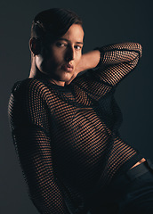 Image showing Gender neutral person, fashion and style in portrait on dark background, trendy and edgy. Creative, gen z and beauty, lgbtq and queer with cosmetics, serious and non binary with designer clothes