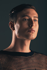 Image showing Gender neutral person, fashion and lgbtq gen z youth, face and beauty, edgy style on dark background in studio. Non binary, lgbt community and queer model, trendy and designer clothes with cosmetics