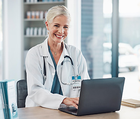 Image showing Healthcare, laptop and portrait of senior woman doctor in hospital office planning and medical research work. Health, wellness and online medicine, confident mature professional at desk with computer