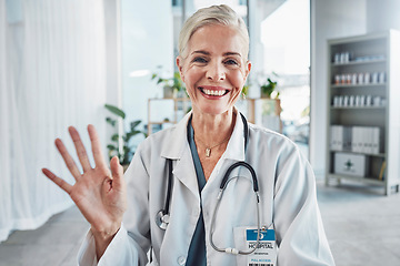 Image showing Video call, smile and wave, portrait of woman doctor in hospital office, communication and success in medical work. Health, medicine and face of confident mature professional and online consultation.