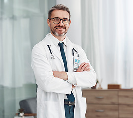 Image showing Healthcare, smile and portrait of doctor, man in hospital for support, success and help in medical work. Health, wellness and medicine, confident mature professional with stethoscope and leadership.
