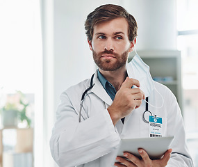 Image showing Healthcare, tablet and doctor with mask in hospital for wellness, medical care and surgery report. Covid mockup, life insurance and man with digital tech for research, patient data and telehealth app