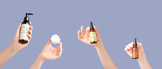 Image showing Skincare products, model hands and essential oil bottles for dermatology and cosmetics. Studio beauty, wellness and self care with hyaluronic acid for collagen production with purple background