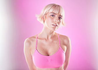 Image showing Young woman, portrait and fitness with gen z, fashion and exercise, trendy and beauty on pink background. Sports style with mockup space, wellness and female face, youth and dream with fog and active