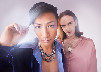 Image showing Gay, makeup portrait and people isolated on studio background in beauty glow, fashion and gen z aesthetic. Face, diversity and queer, lgbtq or transgender couple of friends in trendy cosmetics