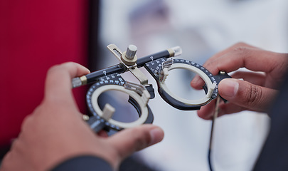 Image showing Glasses, trail frame and lens with test and ophthalmologist tools, woman hands zoom with healthcare for eyes and prescription. Optometry, eye care and optometrist, medicine and chart with measurement