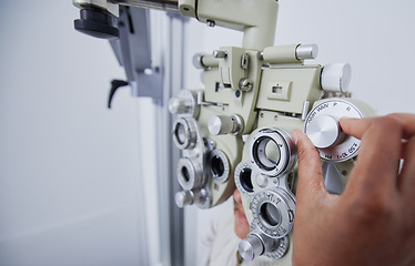 Image showing Eye exam, vision and hands of optometrist with patient in clinic for test, eyesight and optical assessment. Optometry, healthcare and optician with woman in phoropter, medical machine and lens