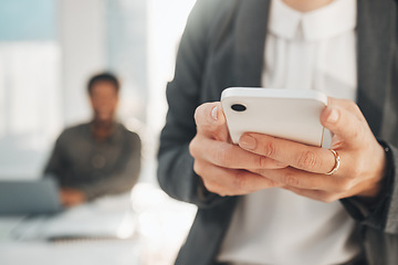 Image showing Hands, business phone and typing in office, texting or social media in company workplace. Technology, cellphone and woman or female entrepreneur with mobile smartphone for networking or web browsing.