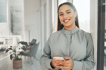 Image showing Portrait, phone and face with a business black woman in her office, sending a text message for communication. Smile, mobile and contact with a happy female employee networking or texting at work