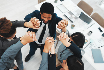 Image showing Collaboration, teamwork and above business people holding hands in support of vision, growth or training in office. Team building, group and hand unity in motivation, partnership or corporate startup