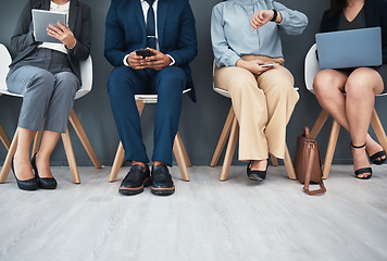Image showing Legs, recruitment and business people in waiting room for interview with human resources. Hr hiring, job opportunity and group of candidates, men and women with devices in company for employment.