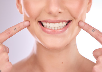 Image showing Mouth, dental and oral hygiene with a model woman in studio on a gray background for teeth whitening. Dentist, healthcare and veneers with a female indoor to show a happy smile at a tooth specialist