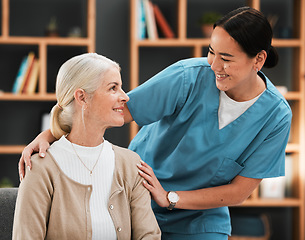 Image showing Nursing home, senior woman and nurse with a smile from retirement and support happiness. Bonding, healthcare and Asian caregiver feeling happy from elderly care and medical job with a elderly female