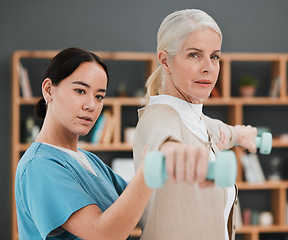 Image showing Senior patient, dumbbell and physiotherapy rehabilitation nurse help for fitness, muscle and support. Healthcare physiotherapist woman with elderly person for physical therapy and stretching exercise