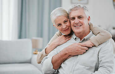 Image showing Portrait, love and mockup with a senior couple hugging in the living room of their house together. Smile, space or trust with a happy mature man and woman bonding while enjoying retirement at home