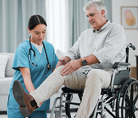 Image showing Asian physiotherapist, senior man and wheelchair for legs rehabilitation, recovery or nursing home care. Physiotherapy expert, helping hand and elderly patient with injury, disability and hurt muscle